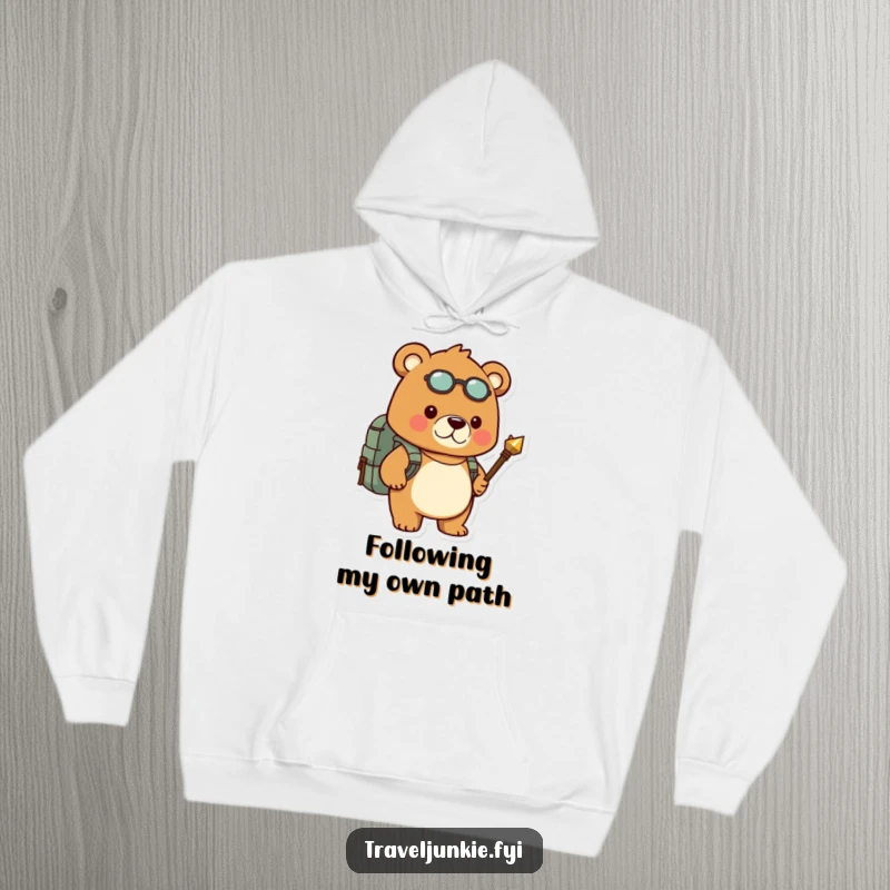 Funny hoodie shows a determined bear carrying a backpack and compass, ready for any humorous outdoor challenge.