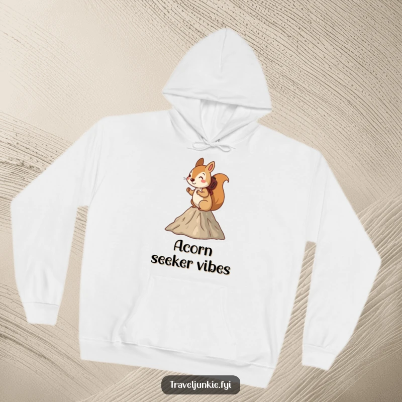Funny squirrel hoodie, a determined squirrel hiking up a small mountain, designed for cozy adventures and outdoor exploration.