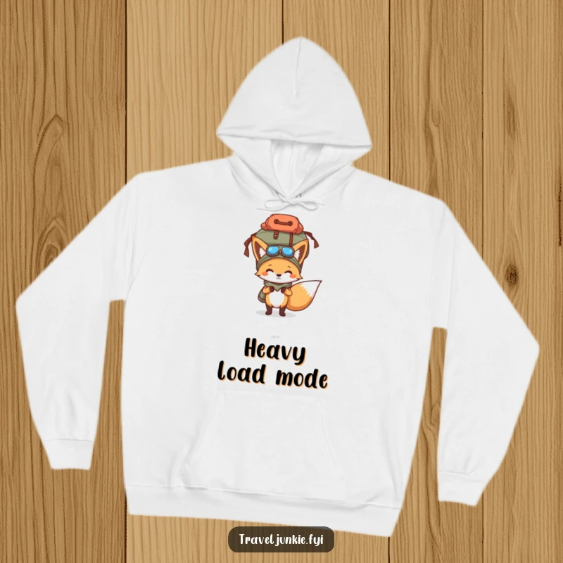 Funny hoodie depicting a determined fox with an excessively full travel bag balanced on its head, perfect for a cozy, humorous gift.