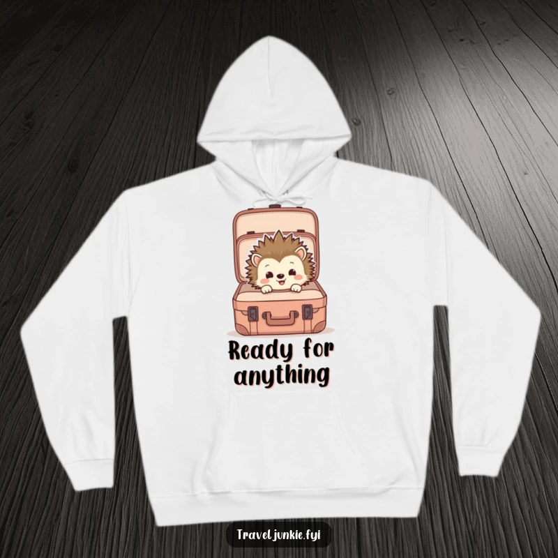 Funny hoodie featuring a hedgehog peering into a suitcase, ideal for cozy wear and expressing a love for travel and humor.