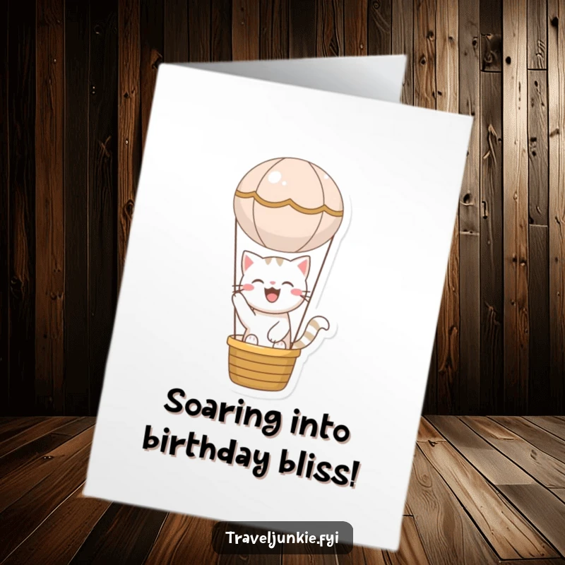 Funny Free Printable Birthday Card: Joyful cat happily riding in a miniature hot air balloon, celebrating a birthday.